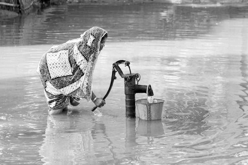 Women and Drinking Water Challenges - Trying to procure a bucket of drinking water amidst floods in West Champaran district, Bihar